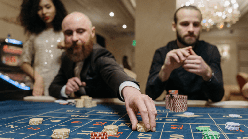 people playing roulette in a casino