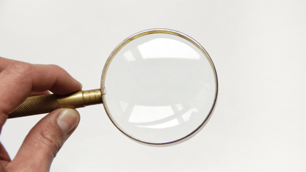 a person holding a magnifying glass