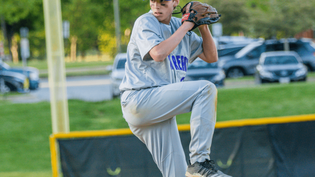 a baseball pitcher throwing the ball during a game