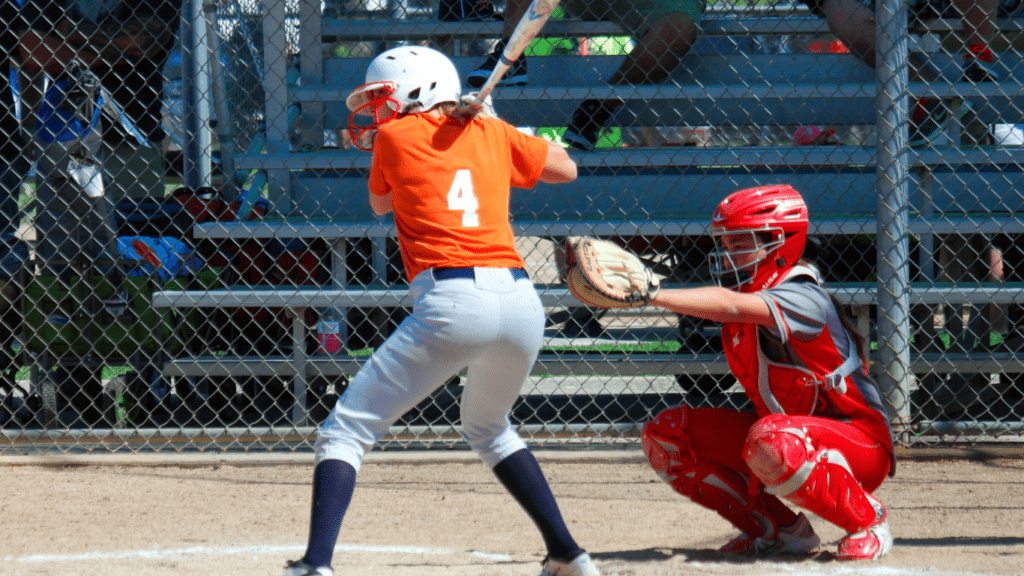 a baseball player swinging at a pitch during a game