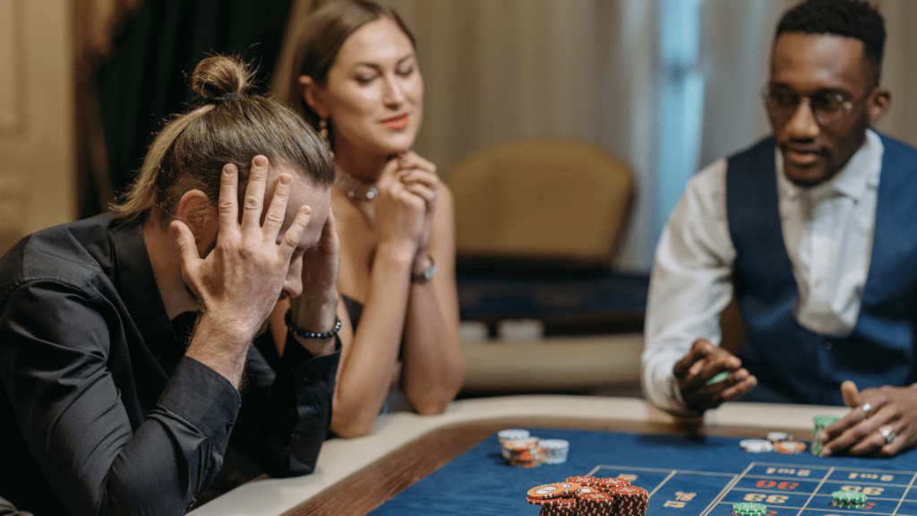 a group of people playing roulette in a casino