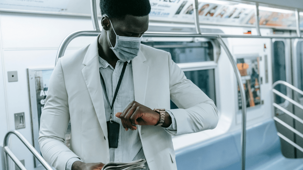 a person in a suit looking at his watch