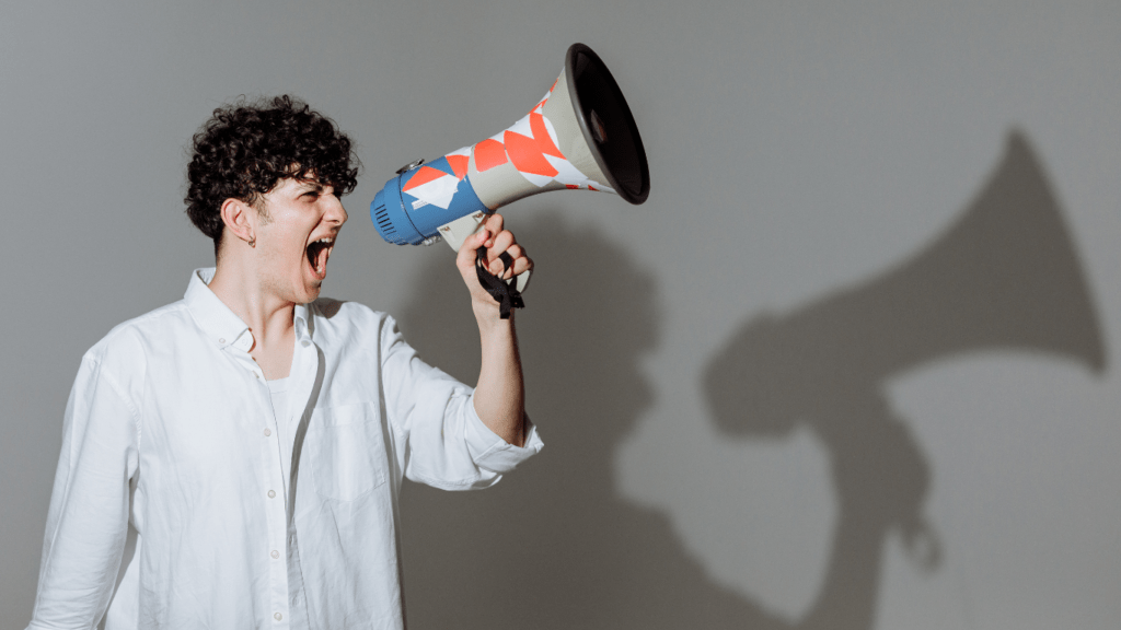 a person shouting into a megaphone